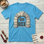 DIMR Bull Terrier T-Shirt flat lay in Sky, featuring carved gray stone arch with a Bull Terrier's face in shallow relief on the keystone and a halo above, with the words the Dog is my Rock.
