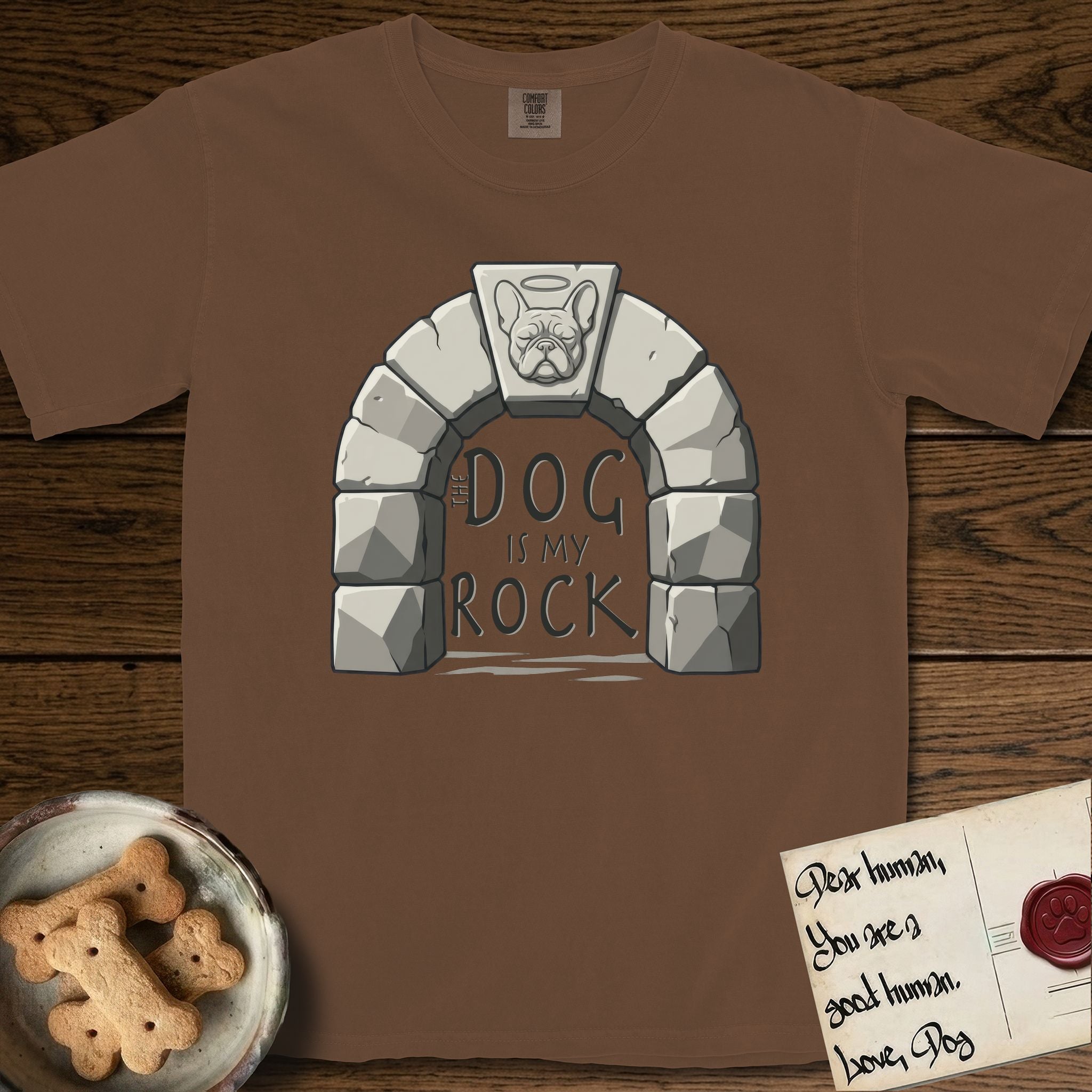 DIMR French Bulldog T-Shirt flat lay in Espresso, featuring carved gray stone arch with a French Bulldog's face in shallow relief on the keystone and a halo above, with the words the Dog is my Rock.