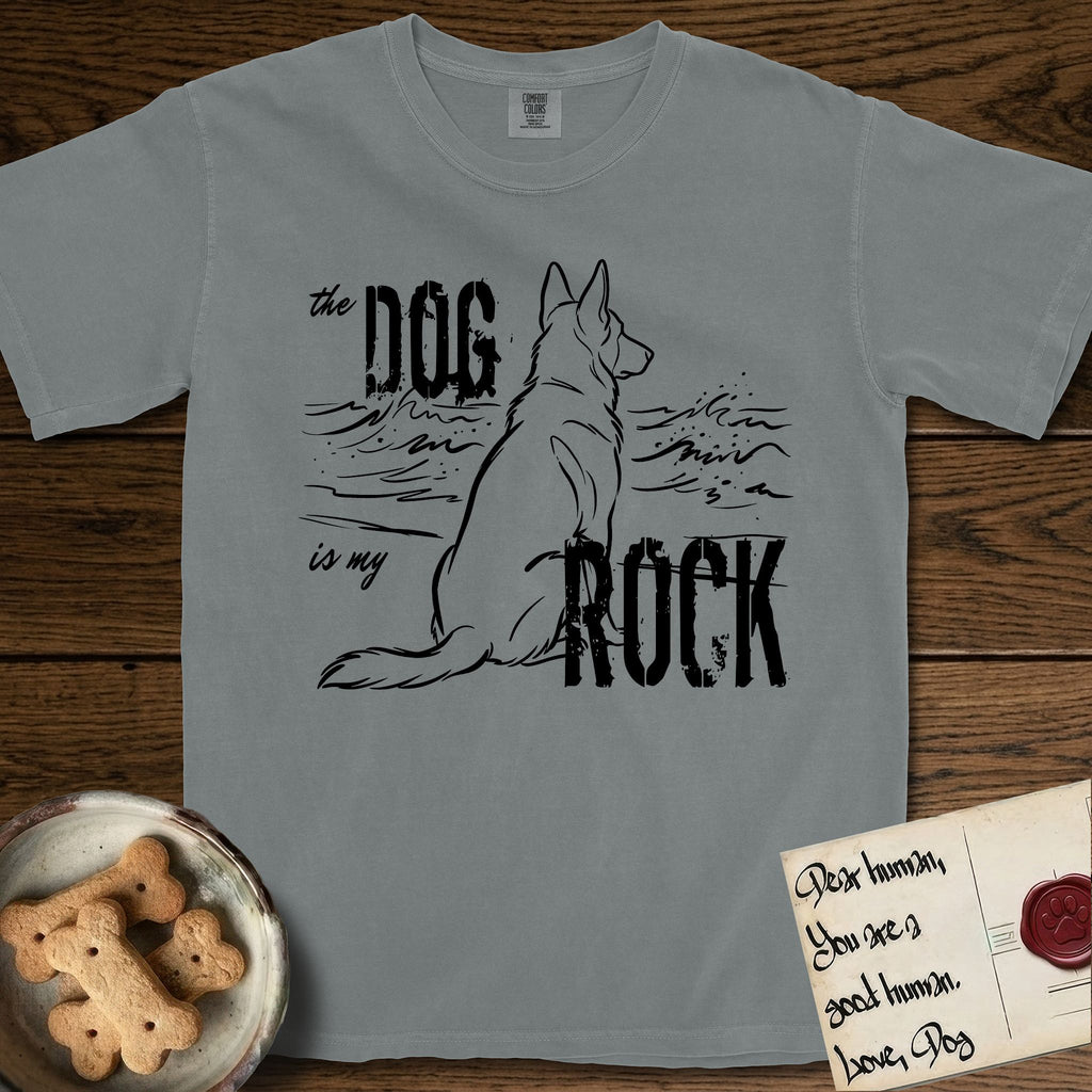 DIMR German Shepherd T-Shirt flat lay in Granite, featuring ink-line illustration of a German Shepherd seen from behind, sitting at the waterline and watching a stormy sea, with the words the Dog is my Rock.