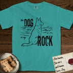 DIMR German Shepherd T-Shirt flat lay in Seafoam, featuring ink-line illustration of a German Shepherd seen from behind, sitting at the waterline and watching a stormy sea, with the words the Dog is my Rock.