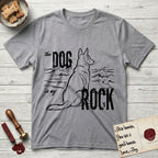 DIMR German Shepherd T-Shirt flat lay in Sport Grey, featuring ink-line illustration of a German Shepherd seen from behind, sitting at the waterline and watching a stormy sea, with the words the Dog is my Rock.