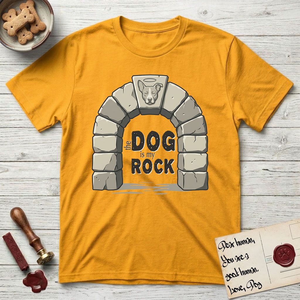 DIMR Lobo T-Shirt flat lay in Gold, featuring carved gray stone arch with Lobo's Cattle Dog face in shallow relief on the keystone and a halo above, with the words the Dog is my Rock.