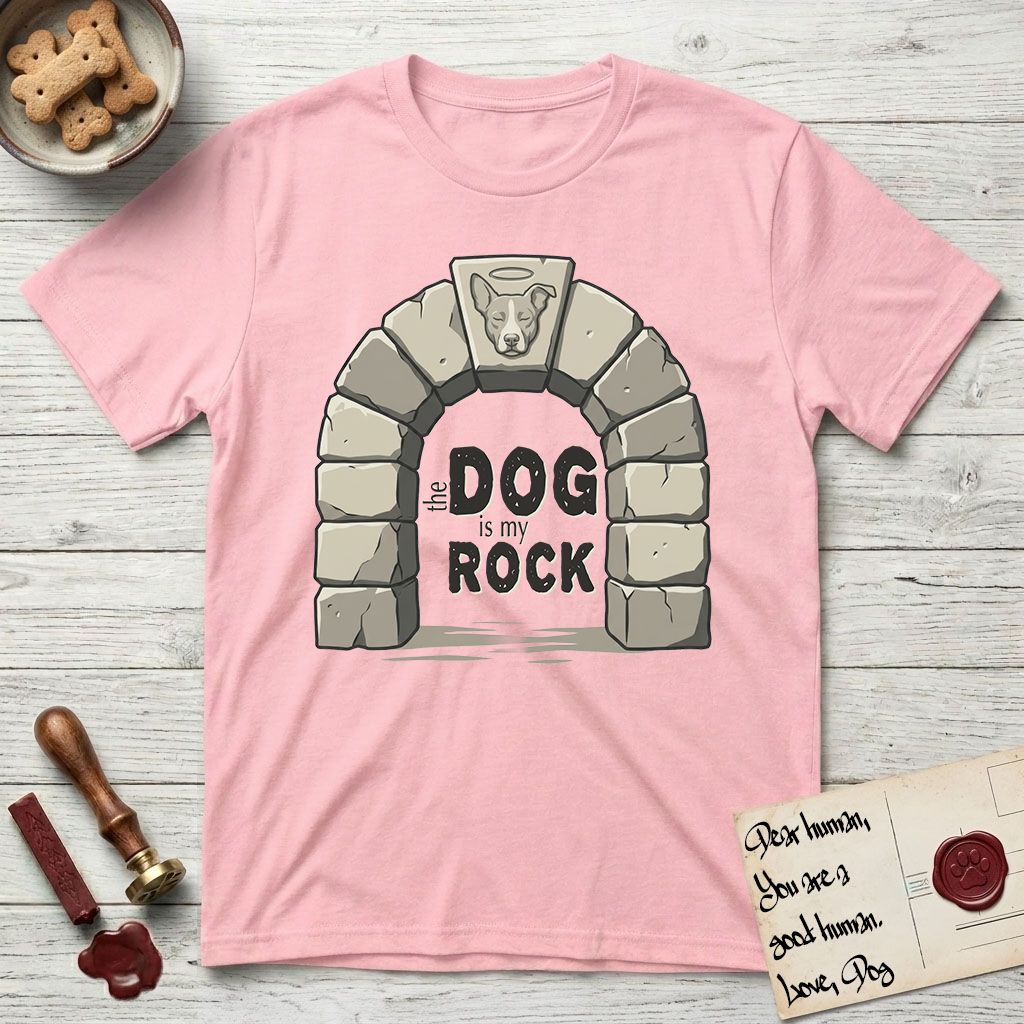 DIMR Lobo T-Shirt flat lay in Light Pink, featuring carved gray stone arch with Lobo's Cattle Dog face in shallow relief on the keystone and a halo above, with the words the Dog is my Rock.