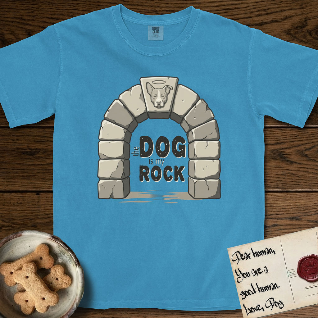 DIMR Lobo T-Shirt flat lay in Royal Caribe, featuring carved gray stone arch with Lobo's Cattle Dog face in shallow relief on the keystone and a halo above, with the words the Dog is my Rock.