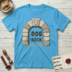 DIMR Lobo T-Shirt flat lay in Sky, featuring carved gray stone arch with Lobo's Cattle Dog face in shallow relief on the keystone and a halo above, with the words the Dog is my Rock.