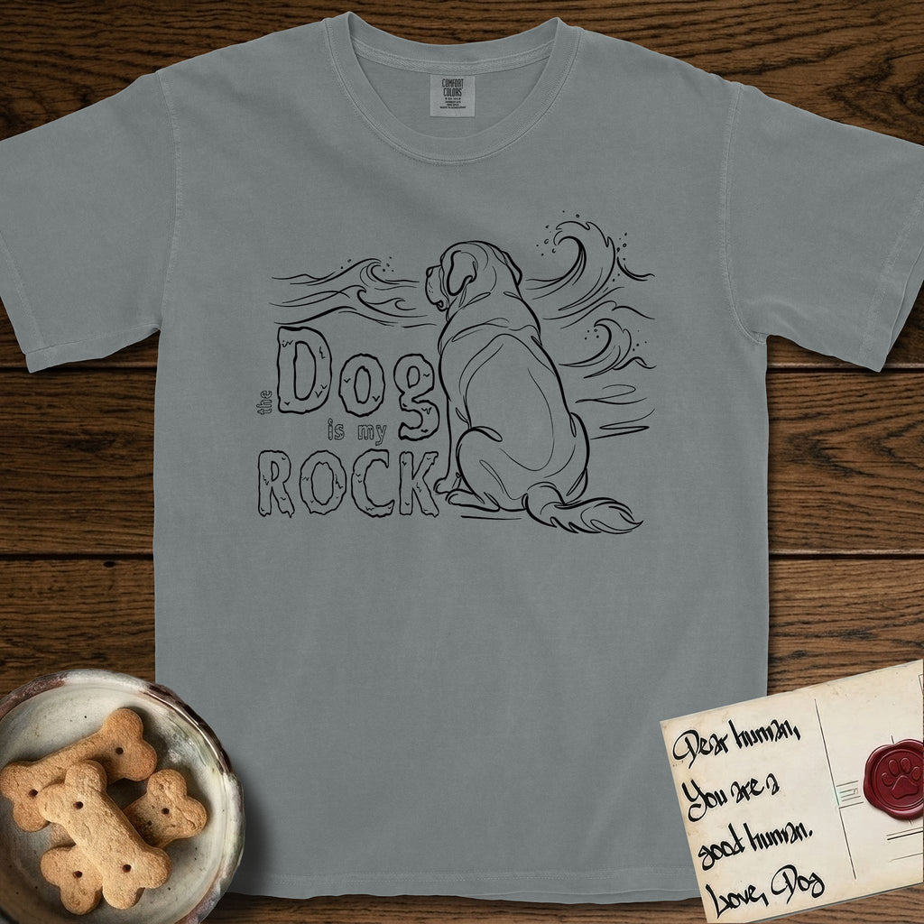 DIMR Saint Bernard T-Shirt flat lay in Granite, featuring ink-line illustration of a Saint Bernard seen from behind, sitting at the water's edge and watching a stormy sea, with the words the Dog is my Rock.