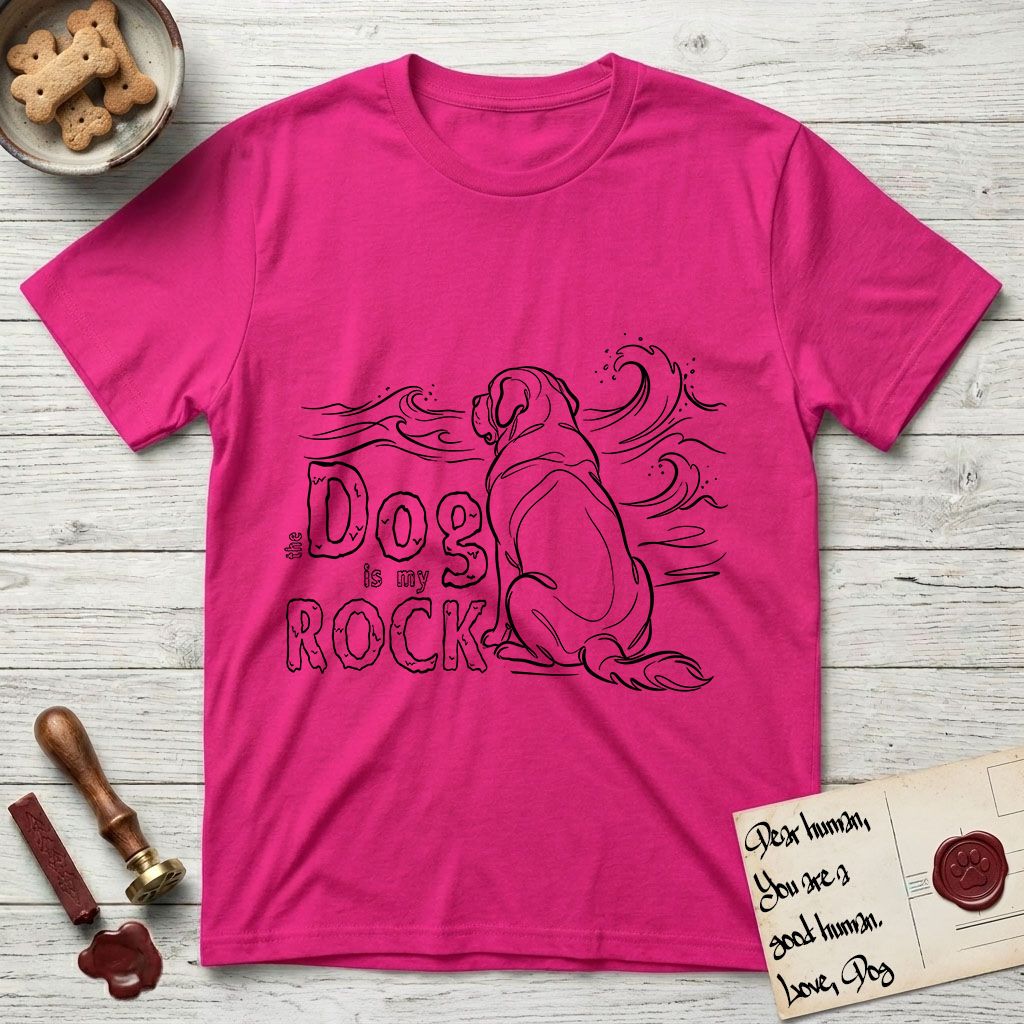 DIMR Saint Bernard T-Shirt flat lay in Heliconia, featuring ink-line illustration of a Saint Bernard seen from behind, sitting at the water's edge and watching a stormy sea, with the words the Dog is my Rock.