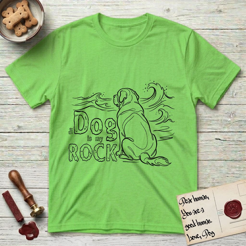 DIMR Saint Bernard T-Shirt flat lay in Lime, featuring ink-line illustration of a Saint Bernard seen from behind, sitting at the water's edge and watching a stormy sea, with the words the Dog is my Rock.
