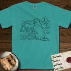 DIMR Saint Bernard T-Shirt flat lay in Seafoam, featuring ink-line illustration of a Saint Bernard seen from behind, sitting at the water's edge and watching a stormy sea, with the words the Dog is my Rock.