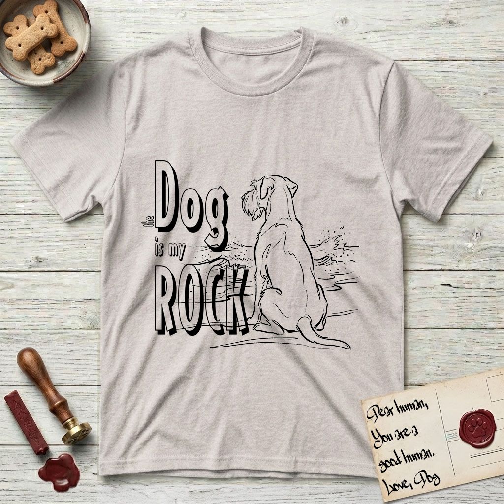 DIMR Schnauzer T-Shirt flat lay in Ice Grey, featuring ink-line illustration of a Schnauzer seen from behind at the water's edge, head turned toward a stormy sea, with the words the Dog is my Rock.