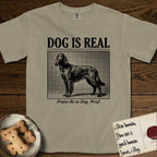 Dog is Real Irish Setter T-Shirt flat lay in Khaki, featuring Black halftone newspaper photo of a feathered Irish Setter standing in profile with head turned to the camera, under the headline DOG IS REAL, with the caption Praise Be to Dog. Woof..
