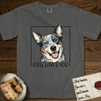 Dog Loves You Australian Cattle Dog T-Shirt flat lay in Pepper, featuring Ink and watercolor portrait of a smiling blue Australian Cattle Dog with a speckled coat, tan eyebrows and upright ears, head tilted inside a black frame above hand-lettered text reading DOG LOVES YOU.