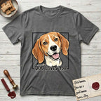 Dog Loves You Beagle T-Shirt flat lay in Dark Heather, featuring Ink and watercolor portrait of a smiling tricolor Beagle with long hanging ears and a cream blaze, head tilted inside a black frame above hand-lettered text reading DOG LOVES YOU.