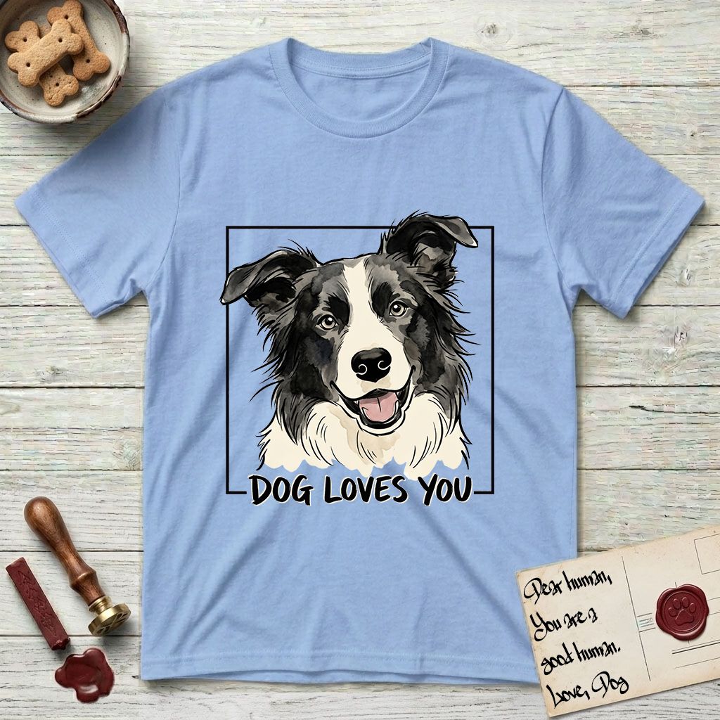 Dog Loves You Border Collie T-Shirt flat lay in Light Blue, featuring Ink and watercolor portrait of a smiling black and white Border Collie with a cream blaze and semi-erect ears, head tilted inside a black frame above hand-lettered text reading DOG LOVES YOU.