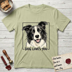 Dog Loves You Border Collie T-Shirt flat lay in Pistachio, featuring Ink and watercolor portrait of a smiling black and white Border Collie with a cream blaze and semi-erect ears, head tilted inside a black frame above hand-lettered text reading DOG LOVES YOU.