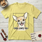 Dog Loves You Chihuahua T-Shirt flat lay in Cornsilk, featuring Ink and watercolor portrait of a smiling fawn Chihuahua with enormous upright bat ears and big round dark eyes, head tilted inside a black frame above hand-lettered text reading DOG LOVES YOU.