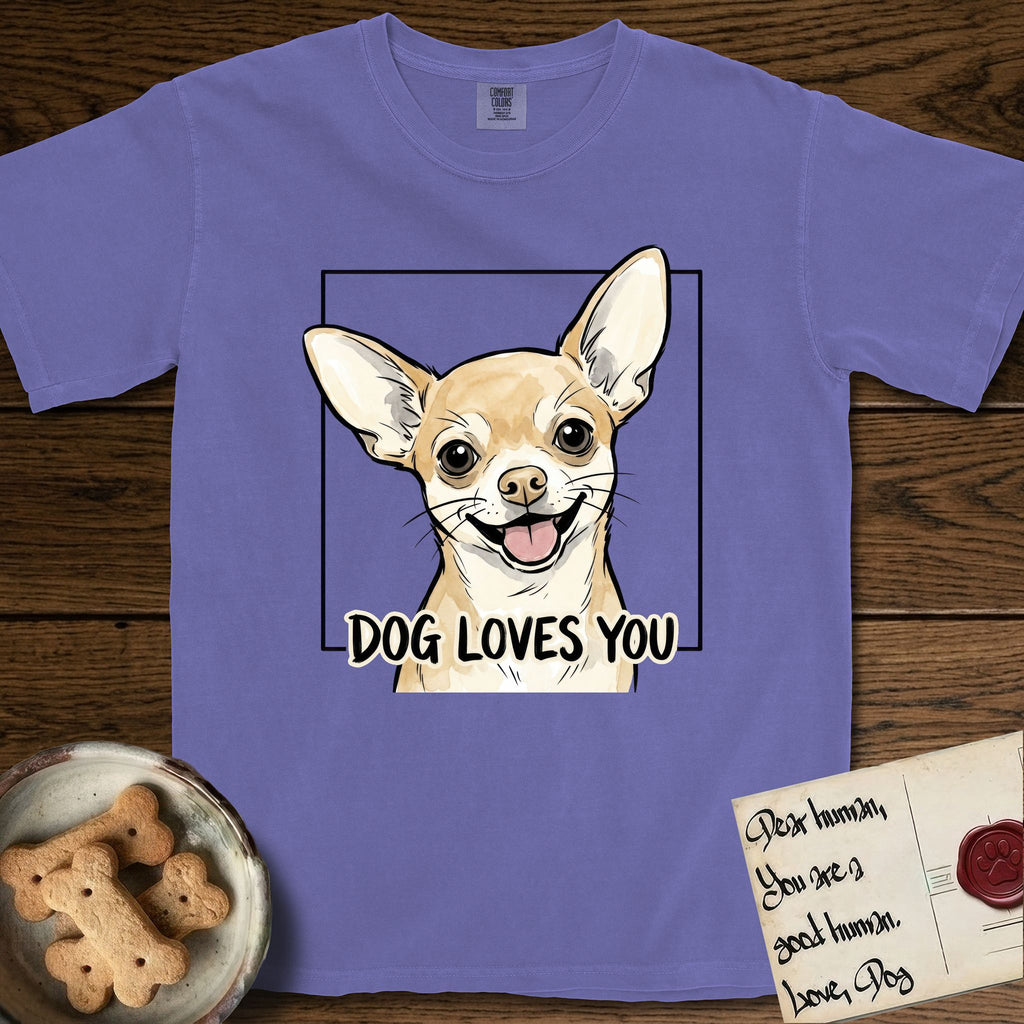Dog Loves You Chihuahua T-Shirt flat lay in Violet, featuring Ink and watercolor portrait of a smiling fawn Chihuahua with enormous upright bat ears and big round dark eyes, head tilted inside a black frame above hand-lettered text reading DOG LOVES YOU.