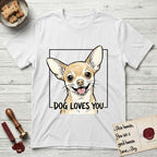Dog Loves You Chihuahua T-Shirt flat lay in White, featuring Ink and watercolor portrait of a smiling fawn Chihuahua with enormous upright bat ears and big round dark eyes, head tilted inside a black frame above hand-lettered text reading DOG LOVES YOU.
