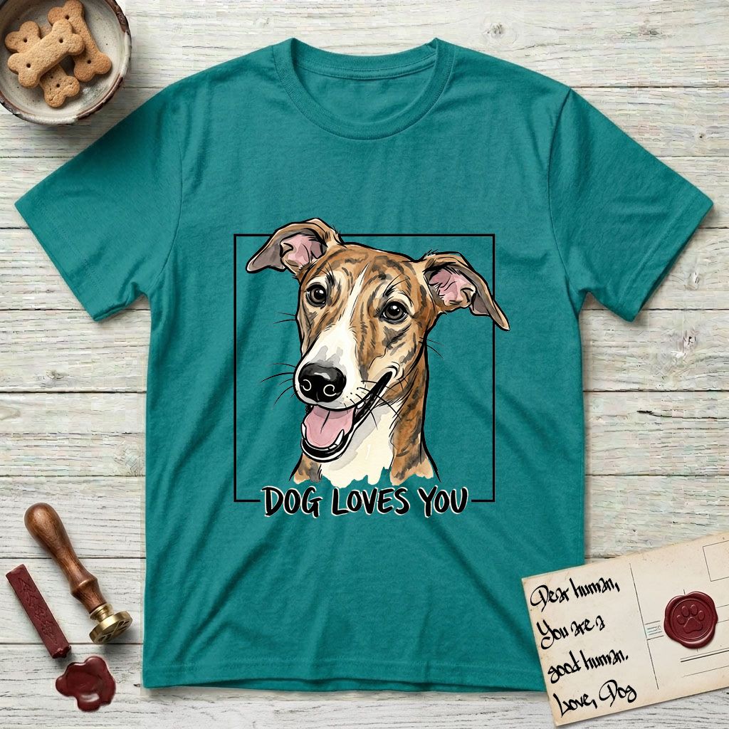Dog Loves You Galgo T-Shirt flat lay in Jade Dome, featuring Ink and watercolor portrait of a smiling brindle Galgo with a long narrow muzzle and folded rose ears, head tilted inside a black frame above hand-lettered text reading DOG LOVES YOU.