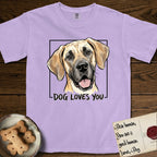 Dog Loves You Great Dane T-Shirt flat lay in Orchid, featuring Ink and watercolor portrait of a smiling fawn Great Dane with a black mask and natural floppy ears, head tilted inside a black frame above hand-lettered text reading DOG LOVES YOU.