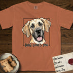 Dog Loves You Great Dane T-Shirt flat lay in Yam, featuring Ink and watercolor portrait of a smiling fawn Great Dane with a black mask and natural floppy ears, head tilted inside a black frame above hand-lettered text reading DOG LOVES YOU.