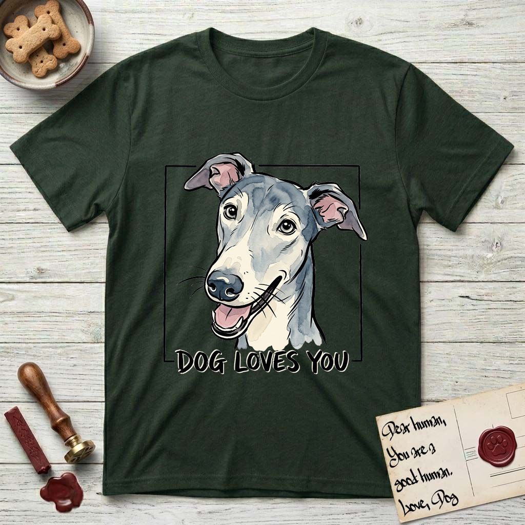 Dog Loves You Greyhound T-Shirt flat lay in Forest Green, featuring Ink and watercolor portrait of a smiling slate blue Greyhound with a long narrow muzzle, cream blaze and folded rose ears, head tilted inside a black frame above hand-lettered text reading DOG LOVES YOU.