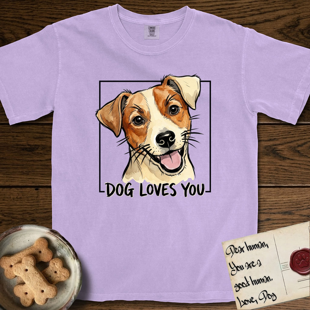Dog Loves You Jack Russell T-Shirt flat lay in Orchid, featuring Ink and watercolor portrait of a smiling cream and rust Jack Russell with folded button ears and keen dark eyes, head tilted inside a black frame above hand-lettered text reading DOG LOVES YOU.