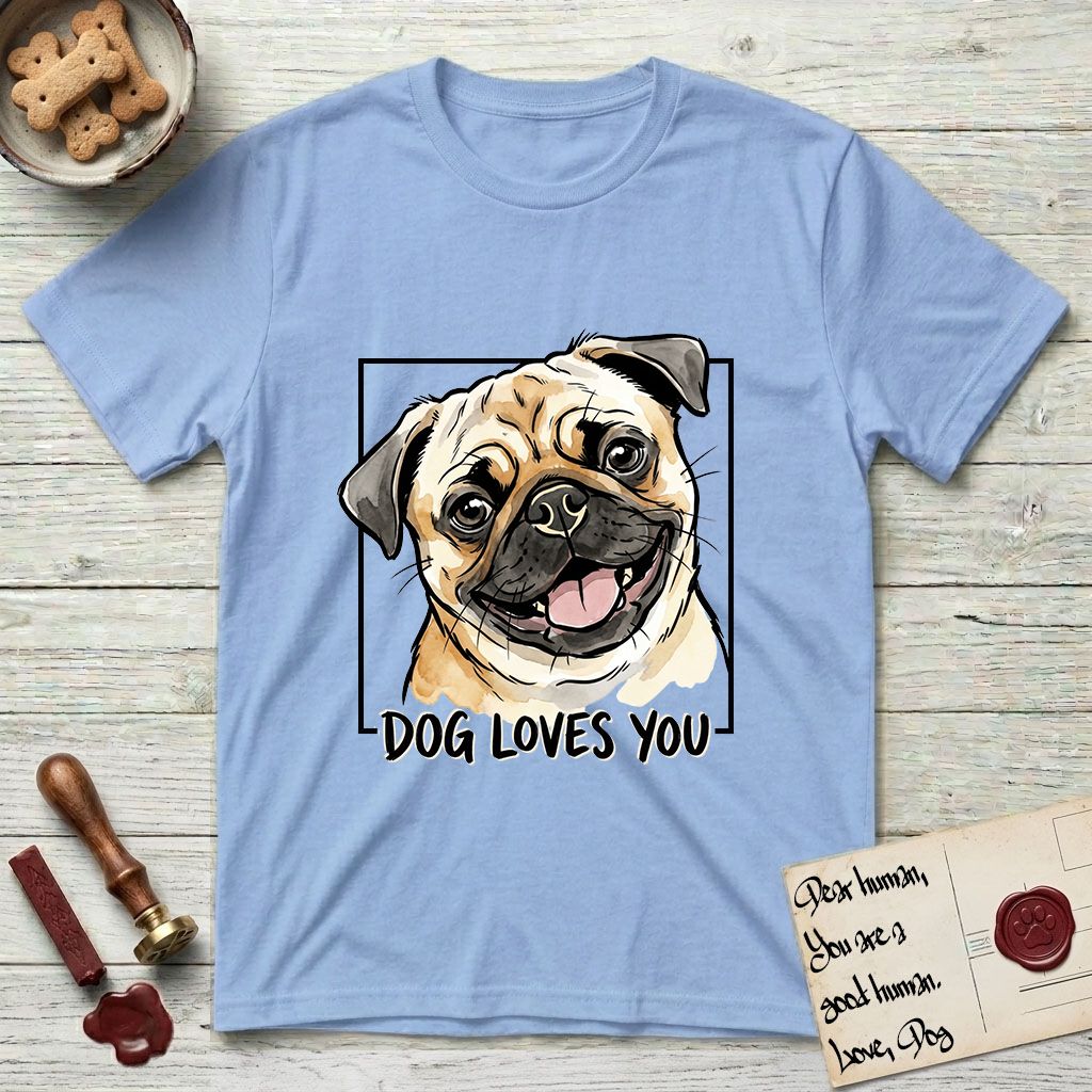 Dog Loves You Pug T-Shirt flat lay in Light Blue, featuring Ink and watercolor portrait of a smiling fawn Pug with a black mask, deep brow wrinkles and big round eyes, head tilted inside a black frame above hand-lettered text reading DOG LOVES YOU.