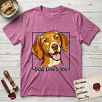 Dog Loves You Vizsla T-Shirt flat lay in Heather Radiant Orchid, featuring Ink and watercolor portrait of a smiling golden rust Vizsla with long silky hanging ears and amber eyes, head tilted inside a black frame above hand-lettered text reading DOG LOVES YOU.