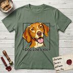 Dog Loves You Vizsla T-Shirt flat lay in Military Green, featuring Ink and watercolor portrait of a smiling golden rust Vizsla with long silky hanging ears and amber eyes, head tilted inside a black frame above hand-lettered text reading DOG LOVES YOU.