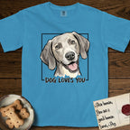 Dog Loves You Weimaraner T-Shirt flat lay in Royal Caribe, featuring Ink and watercolor portrait of a smiling silver grey Weimaraner with long velvet hanging ears and pale amber eyes, head tilted inside a black frame above hand-lettered text reading DOG LOVES YOU.