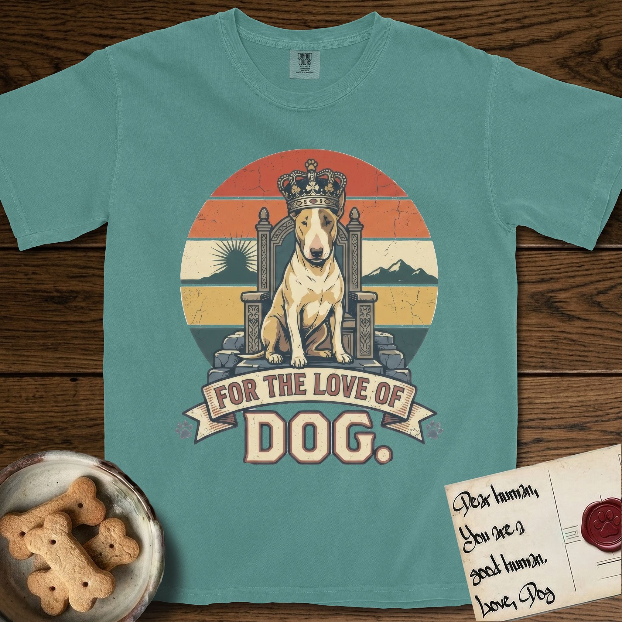 For the Love of Dog Bull Terrier T-Shirt flat lay in Blue Spruce, featuring a vintage badge of a crowned Bull Terrier seated on a throne.