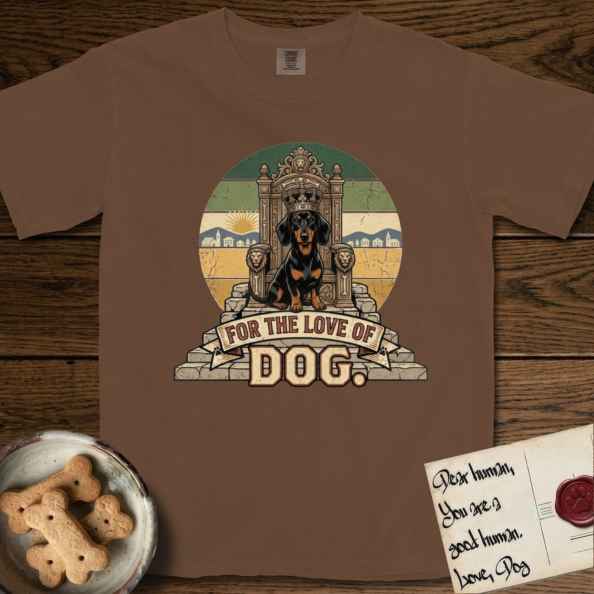 For the Love of Dog Dachshund T-Shirt flat lay in Espresso, featuring a vintage badge of a crowned Dachshund seated on a throne.