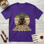 For the Love of Dog Dachshund T-Shirt flat lay in Purple, featuring a vintage badge of a crowned Dachshund seated on a throne.