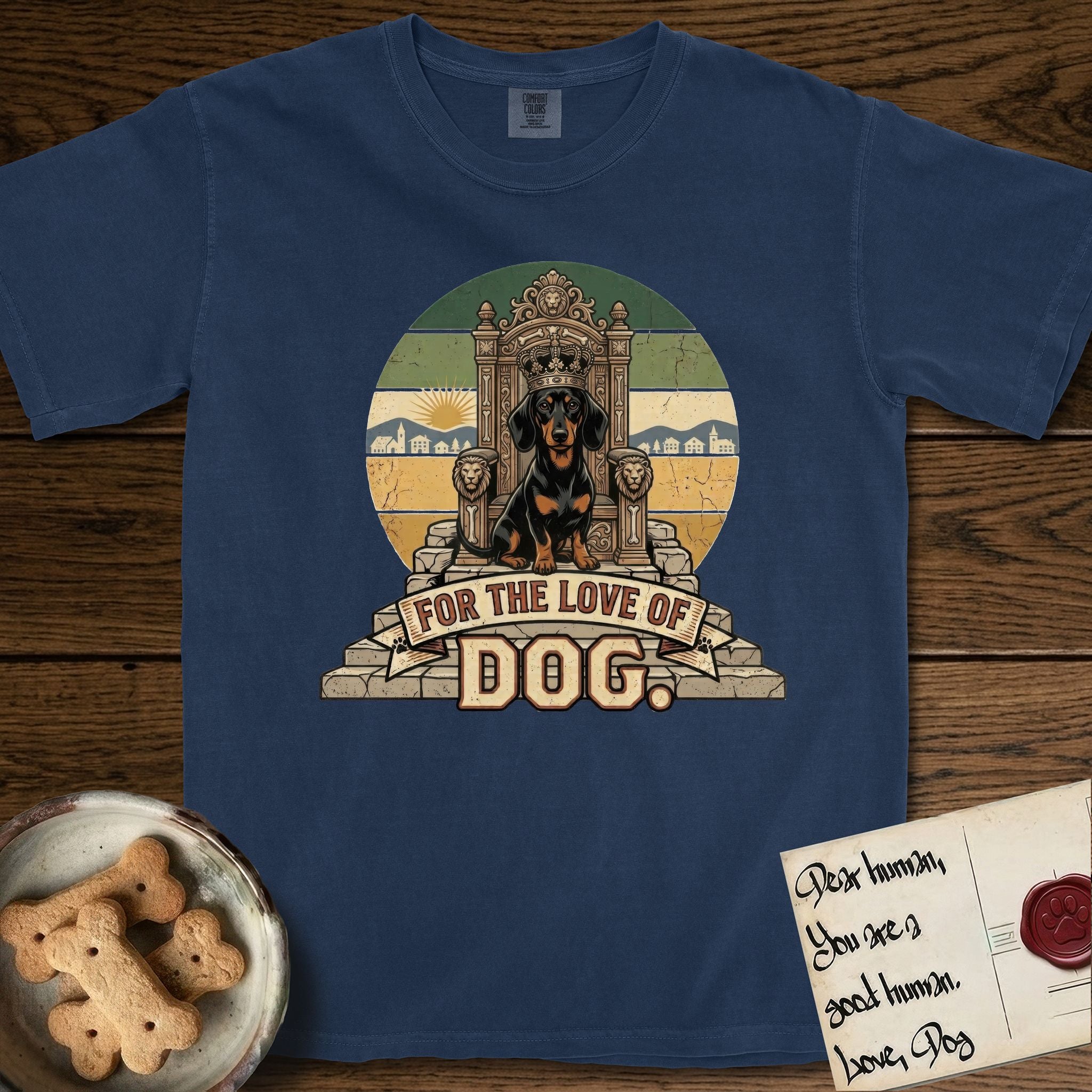 For the Love of Dog Dachshund T-Shirt flat lay in True Navy, featuring a vintage badge of a crowned Dachshund seated on a throne.