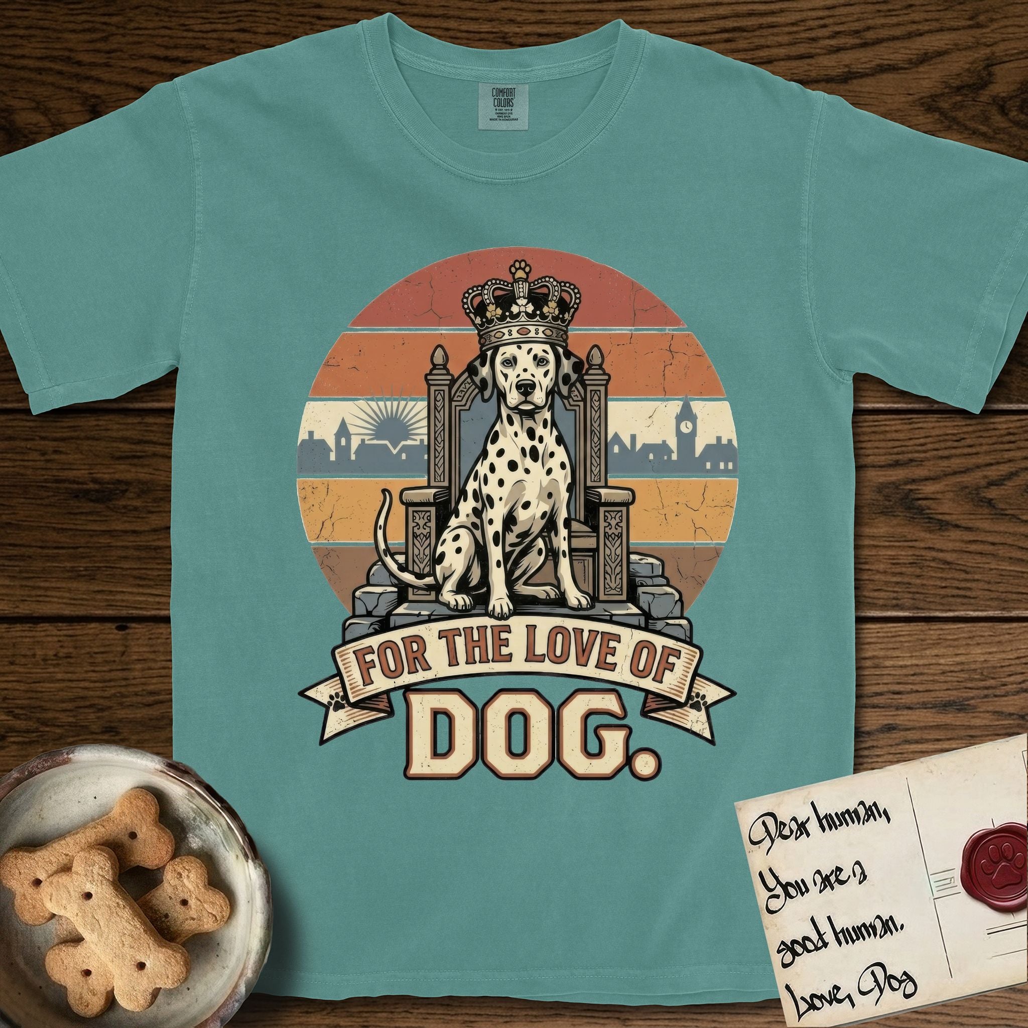 For the Love of Dog Dalmatian T-Shirt flat lay in Blue Spruce, featuring a vintage badge of a crowned Dalmatian seated on a throne.