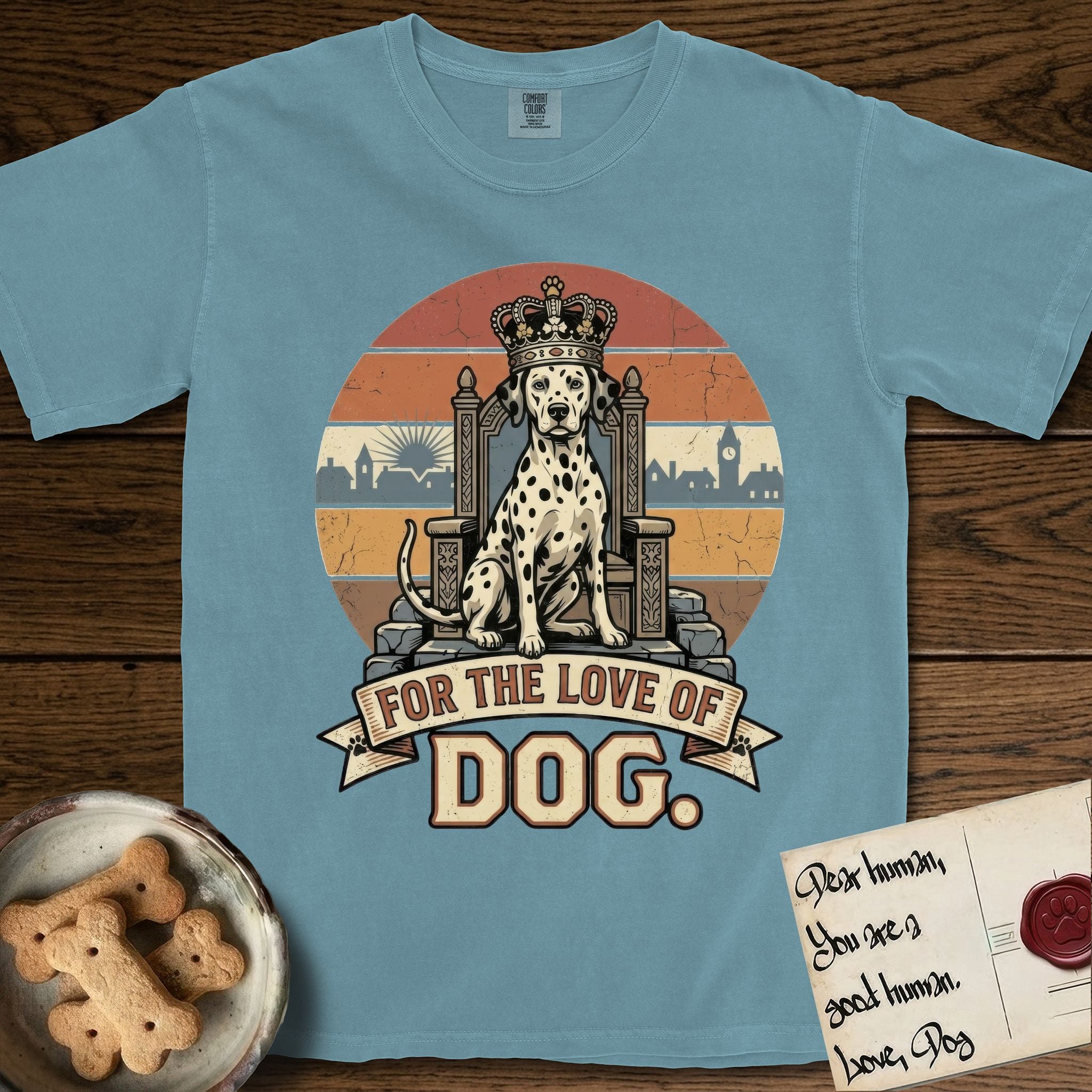 For the Love of Dog Dalmatian T-Shirt flat lay in Ice Blue, featuring a vintage badge of a crowned Dalmatian seated on a throne.