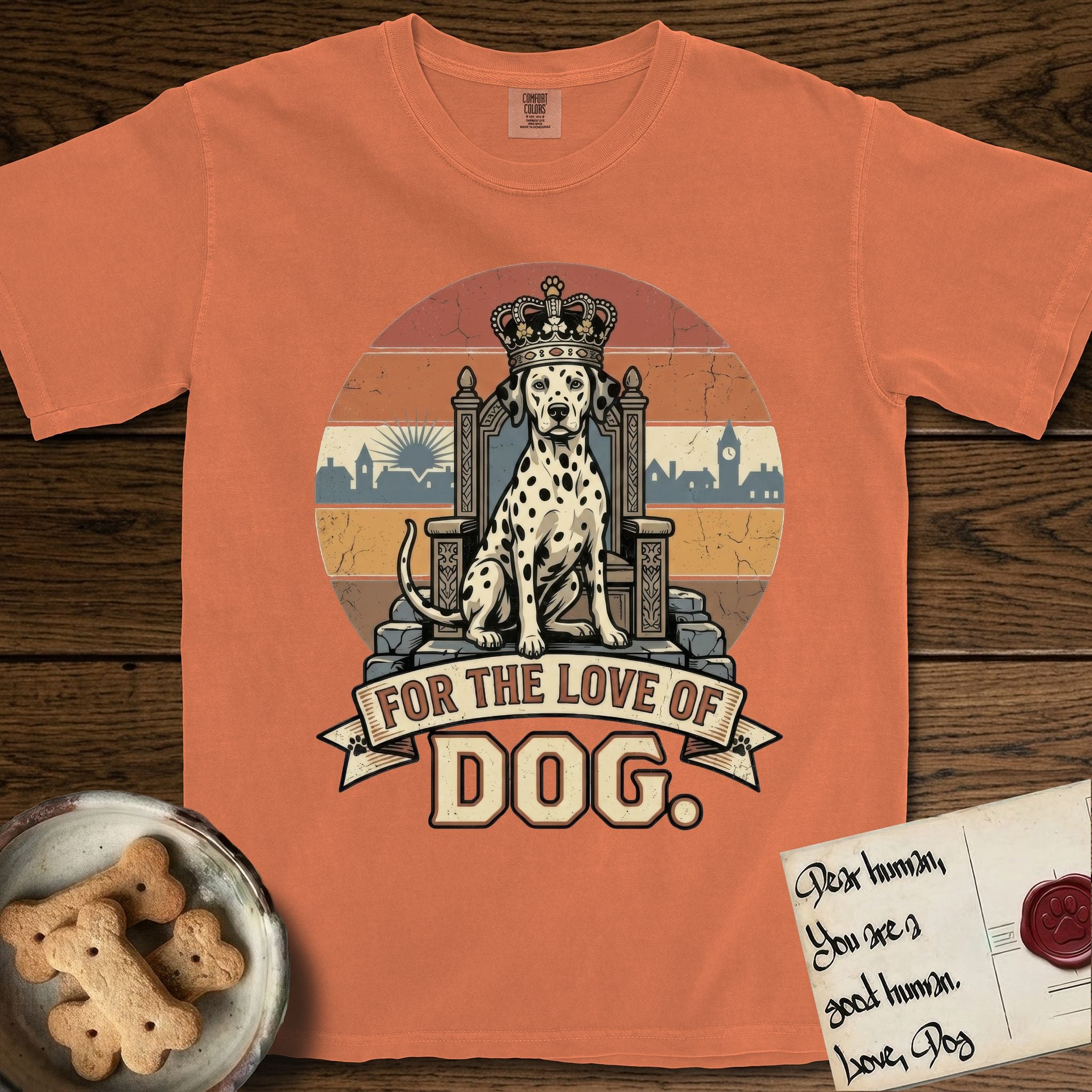 For the Love of Dog Dalmatian T-Shirt flat lay in Melon, featuring a vintage badge of a crowned Dalmatian seated on a throne.