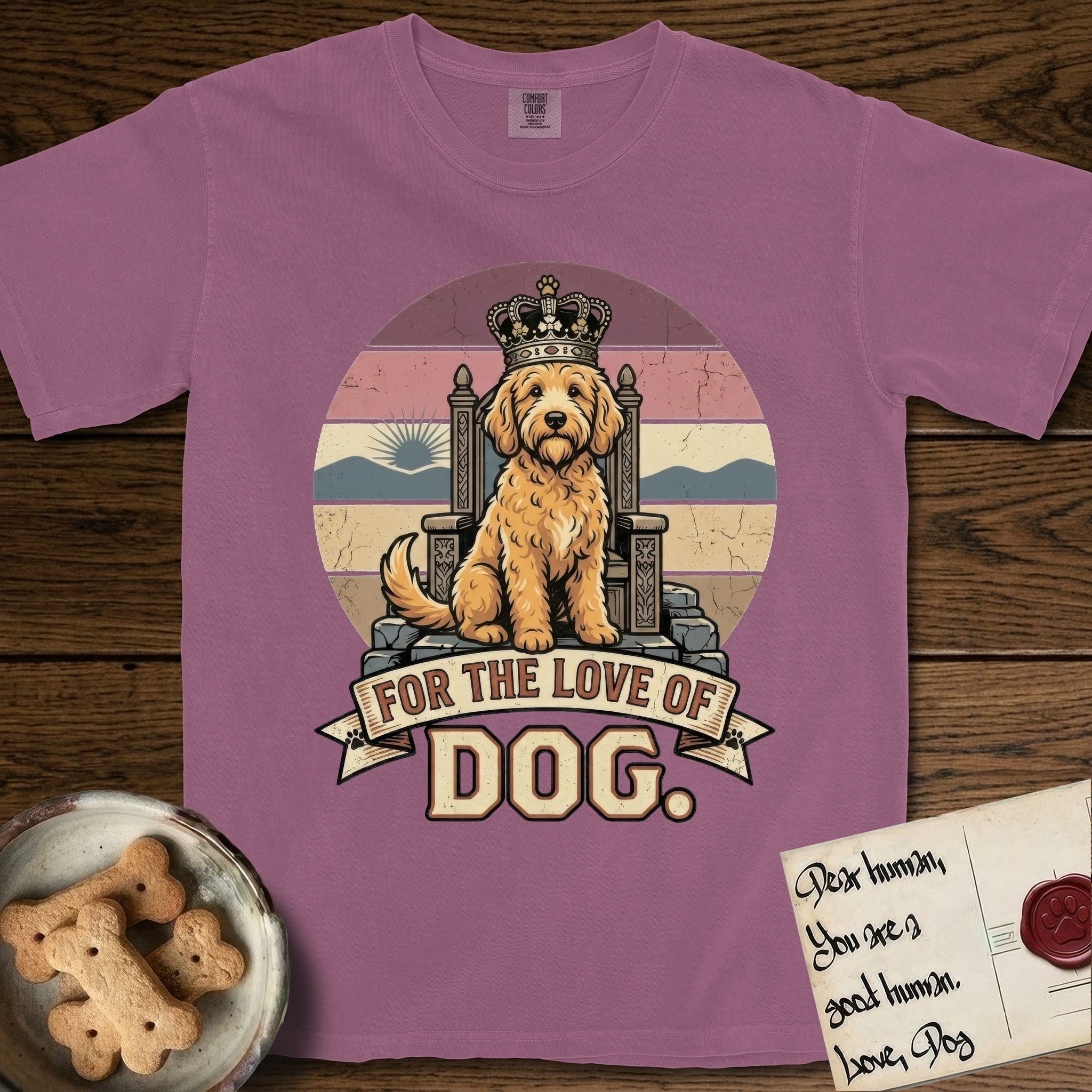 For the Love of Dog Goldendoodle T-Shirt flat lay in Berry, featuring a vintage badge of a crowned Goldendoodle seated on a throne.