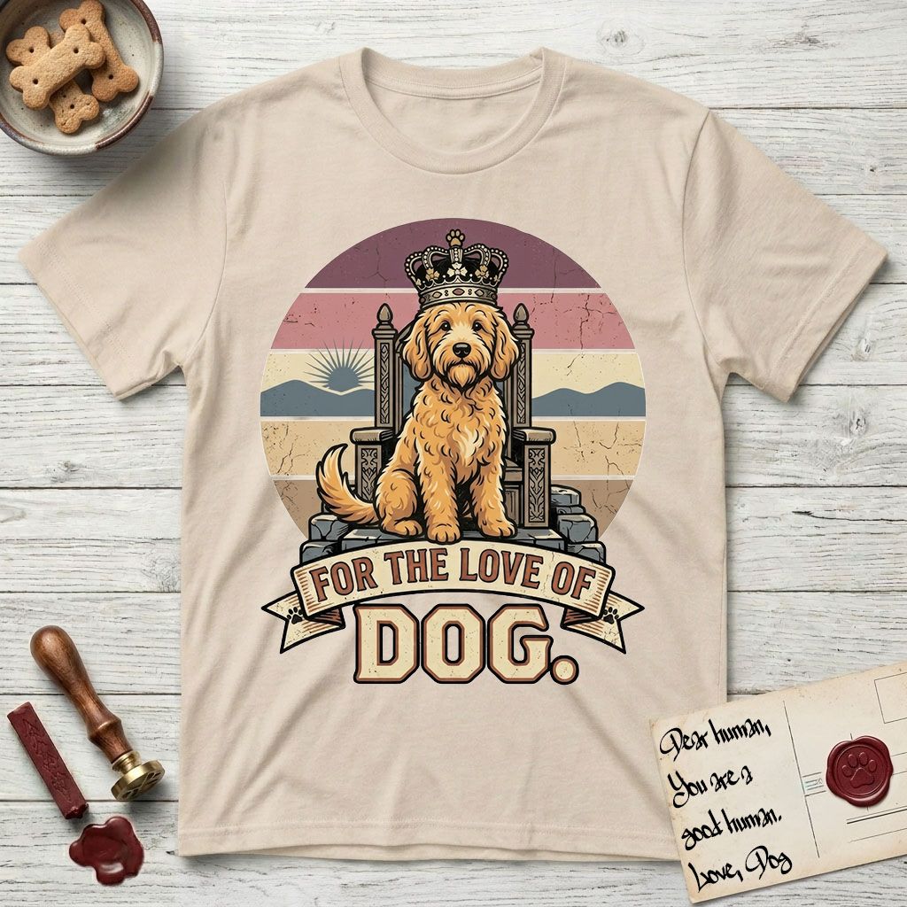 For the Love of Dog Goldendoodle T-Shirt flat lay in Sand, featuring a vintage badge of a crowned Goldendoodle seated on a throne.