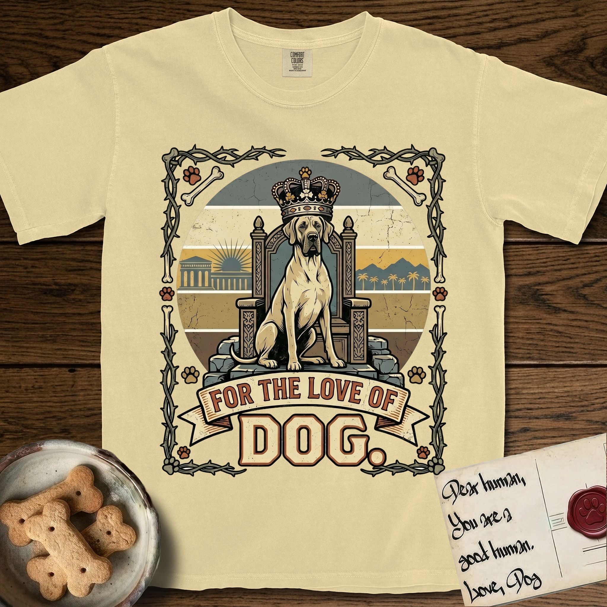 For the Love of Dog Great Dane T-Shirt flat lay in Butter, featuring a vintage badge of a crowned Great Dane seated on a throne.