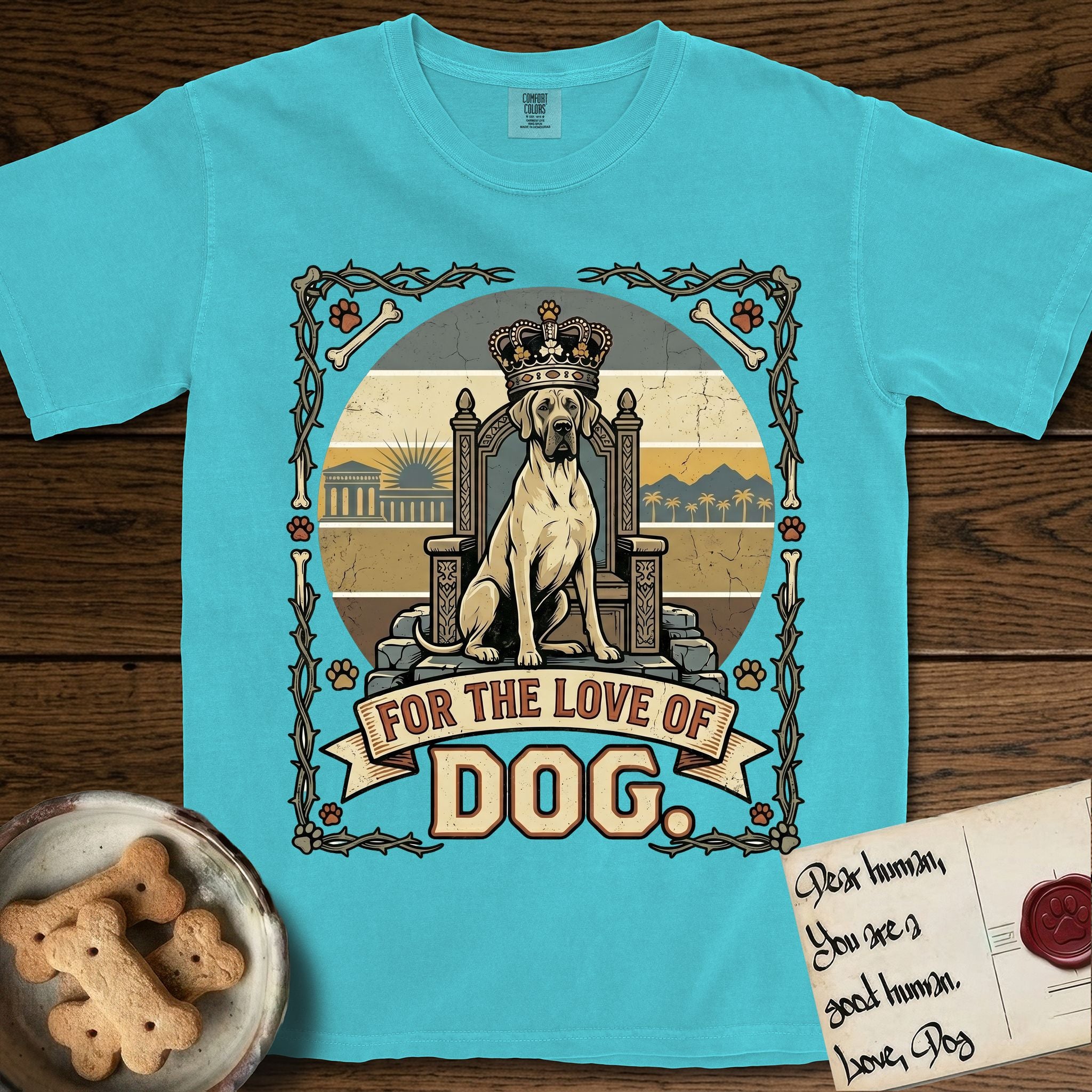 For the Love of Dog Great Dane T-Shirt flat lay in Lagoon Blue, featuring a vintage badge of a crowned Great Dane seated on a throne.