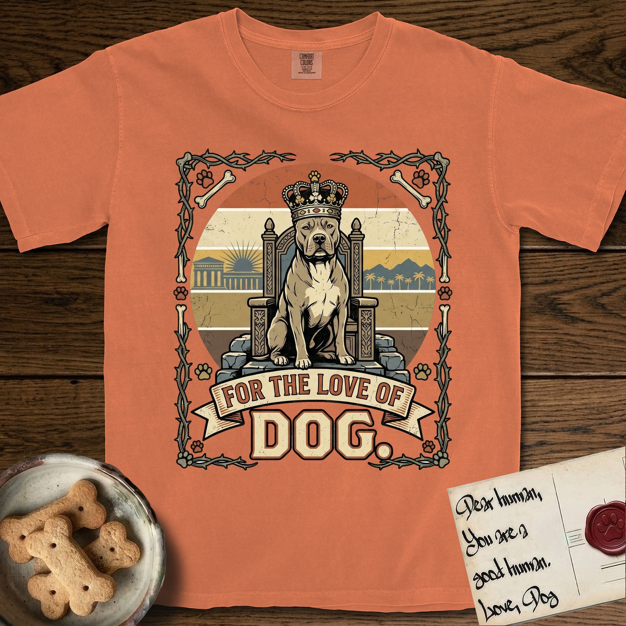 For the Love of Dog Pitbull T-Shirt flat lay in Melon, featuring a vintage badge of a crowned Pitbull seated on a throne.