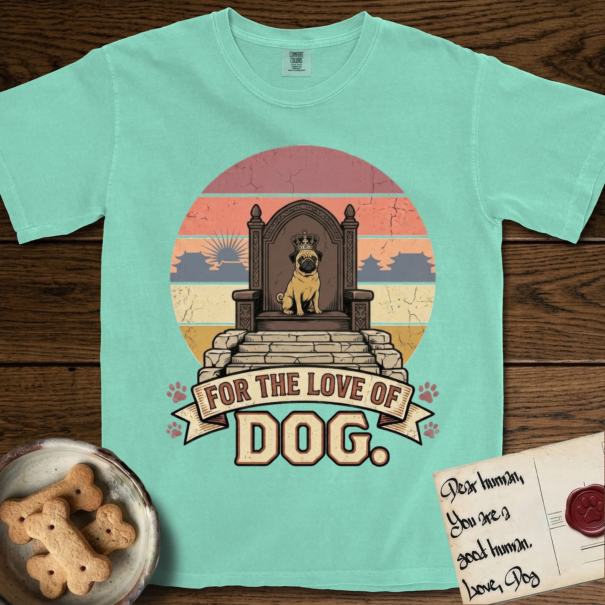 For the Love of Dog Pug T-Shirt flat lay in Island Reef, featuring a vintage badge of a crowned Pug seated on a throne.