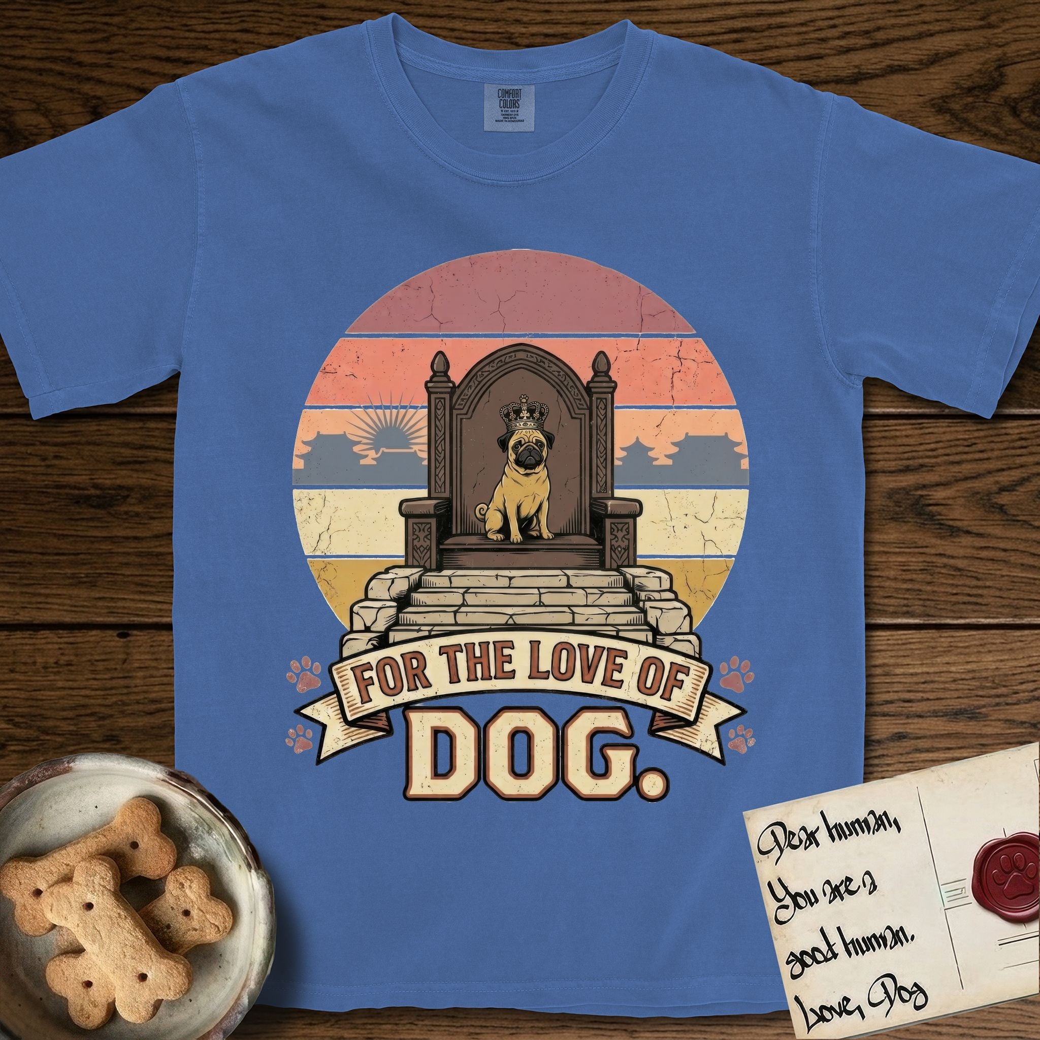 For the Love of Dog Pug T-Shirt flat lay in Mystic Blue, featuring a vintage badge of a crowned Pug seated on a throne.