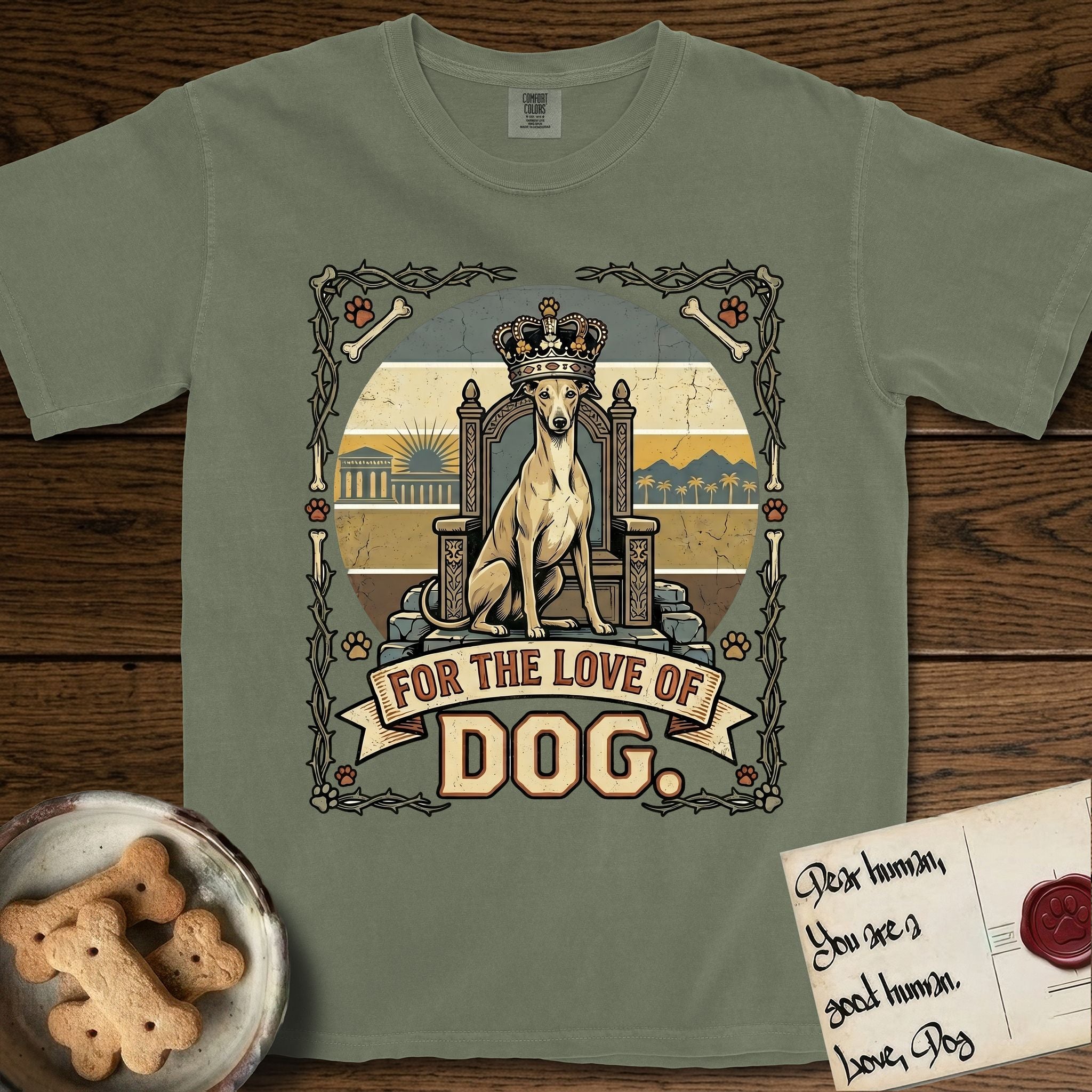 For the Love of Dog Whippet T-Shirt flat lay in Sage, featuring a vintage badge of a crowned Whippet seated on a throne.