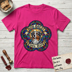 How Great Thou Bark Australian Shepherd T-Shirt flat lay in Heliconia, featuring a full-color stained-glass saint window of a blue merle Australian Shepherd with one blue eye and one amber eye, haloed in golden light.