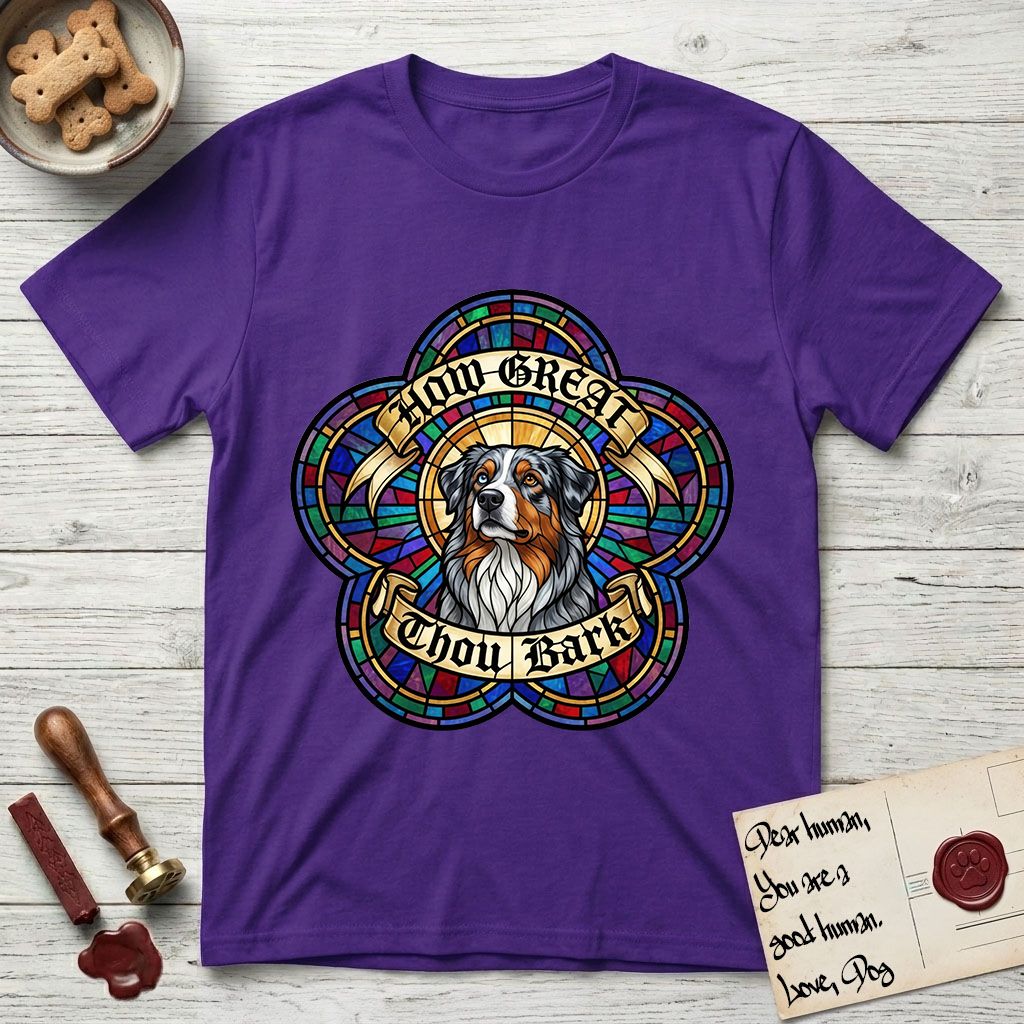 How Great Thou Bark Australian Shepherd T-Shirt flat lay in Purple, featuring a full-color stained-glass saint window of a blue merle Australian Shepherd with one blue eye and one amber eye, haloed in golden light.