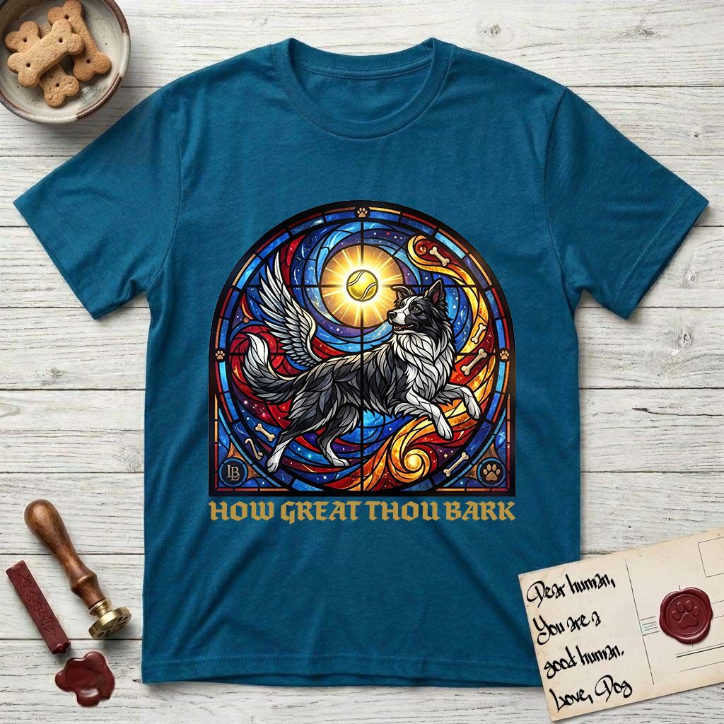 How Great Thou Bark Border Collie T-Shirt flat lay in Antique Sapphire, featuring a full-color stained-glass saint window of a winged Border Collie leaping after a glowing tennis ball, with a halo.