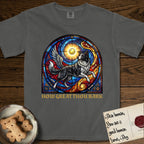 How Great Thou Bark Border Collie T-Shirt flat lay in Pepper, featuring a full-color stained-glass saint window of a winged Border Collie leaping after a glowing tennis ball, with a halo.